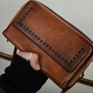 TAN UP LEATHER CLUTCH WITH STUDDED DETAIL ADJUSTABLE CROSS BODY STRAP